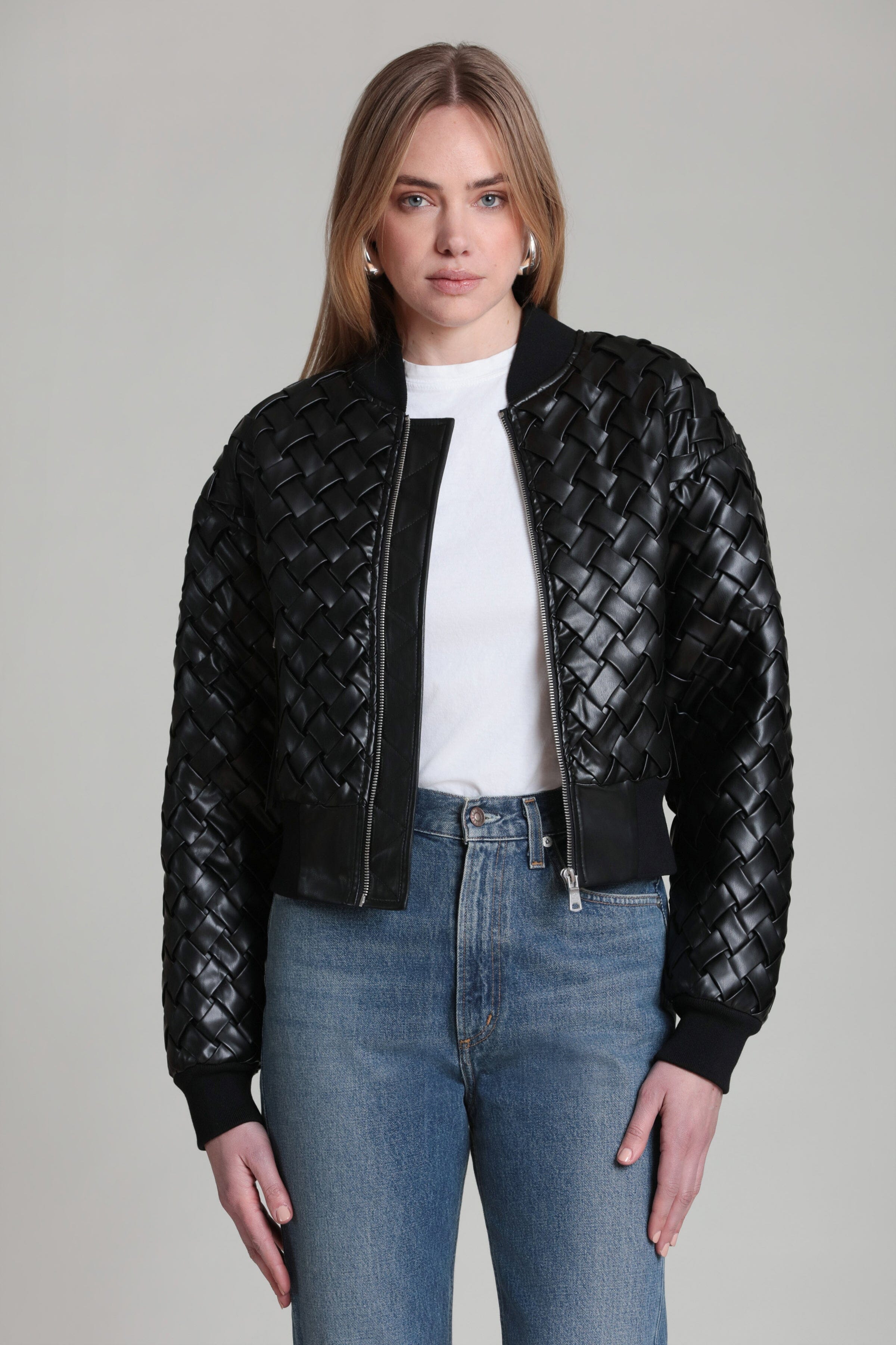 Black woven faux leather bomber jacket with front zipper and ribbed cuffs