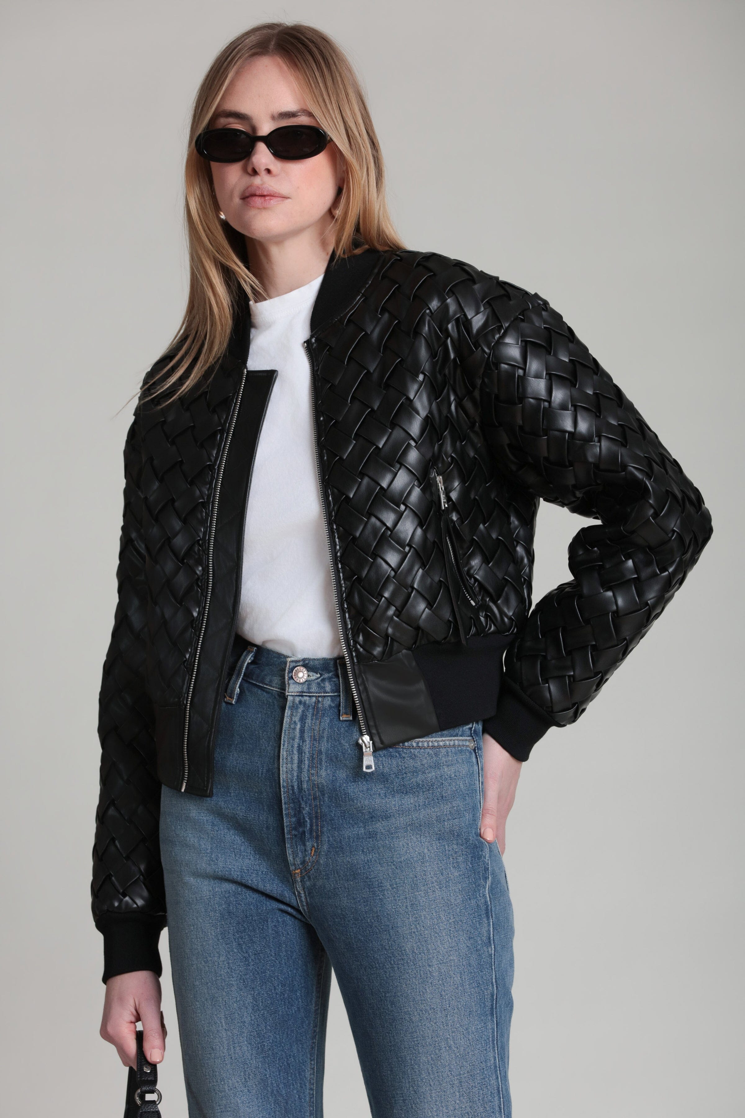 Black woven bomber jacket with front zipper and stand collar, ribbed cuffs