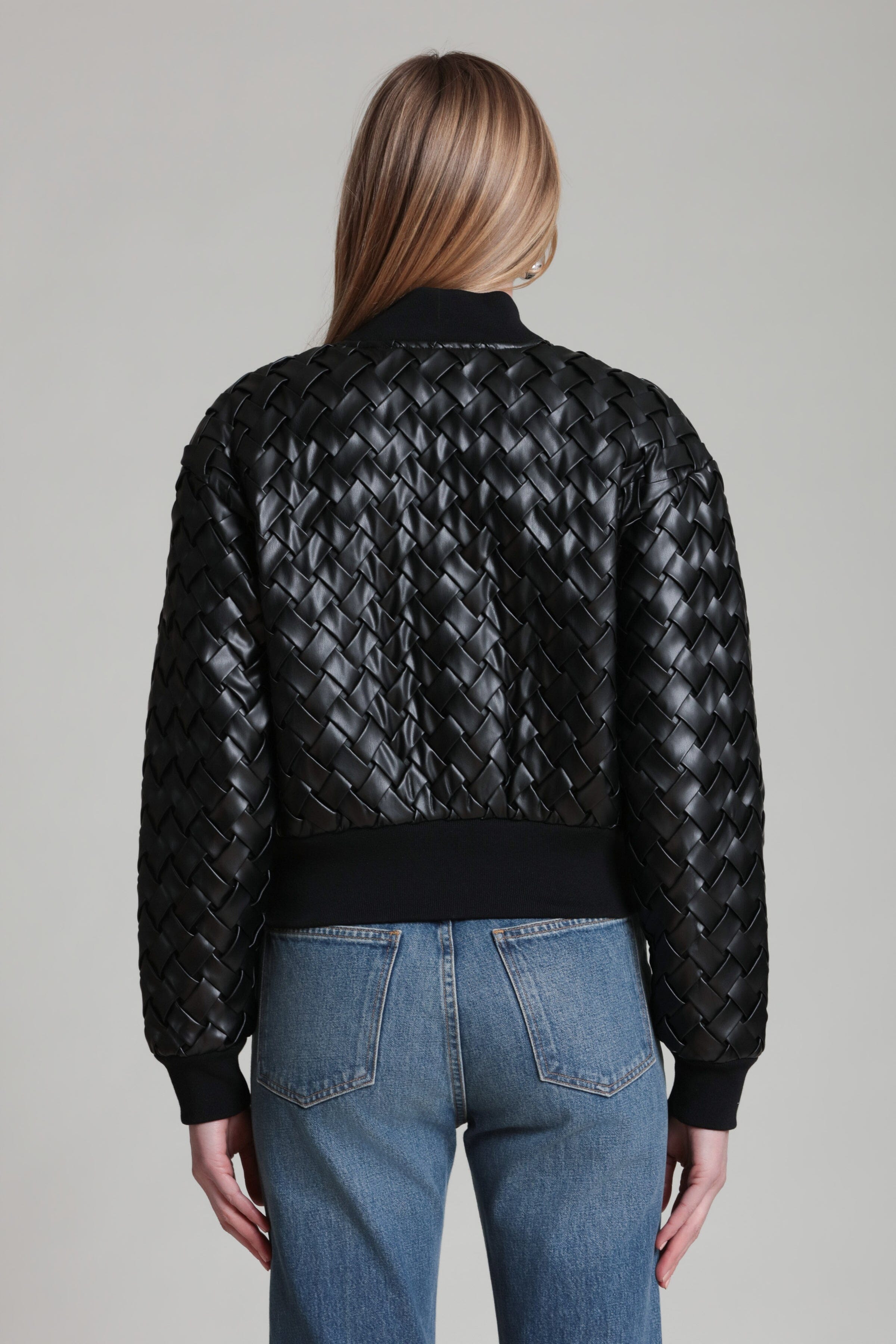 Black bomber jacket with woven texture on back and ribbed collar and cuffs
