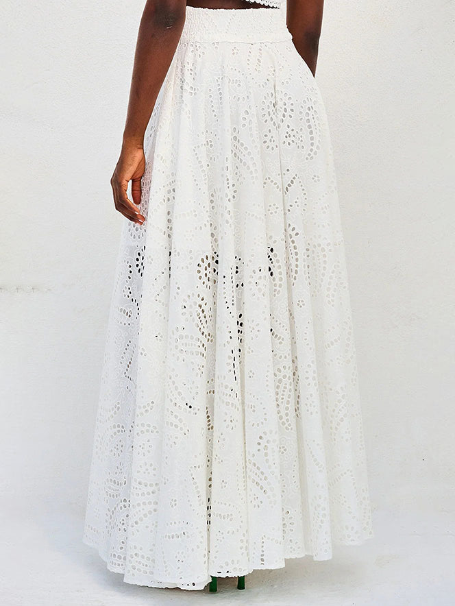 White cotton eyelet maxi skirt with smocked waistband and full gathered hem