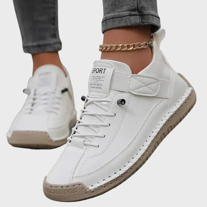 White faux leather lace-up sneakers with ankle strap and beige rubber sole