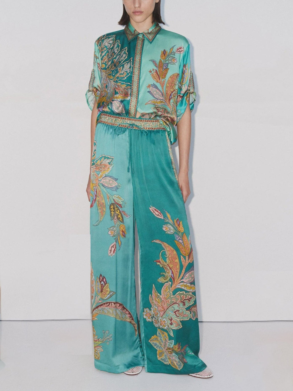 Women’s satin shirt and matching wide-leg pants set in turquoise paisley botanical print