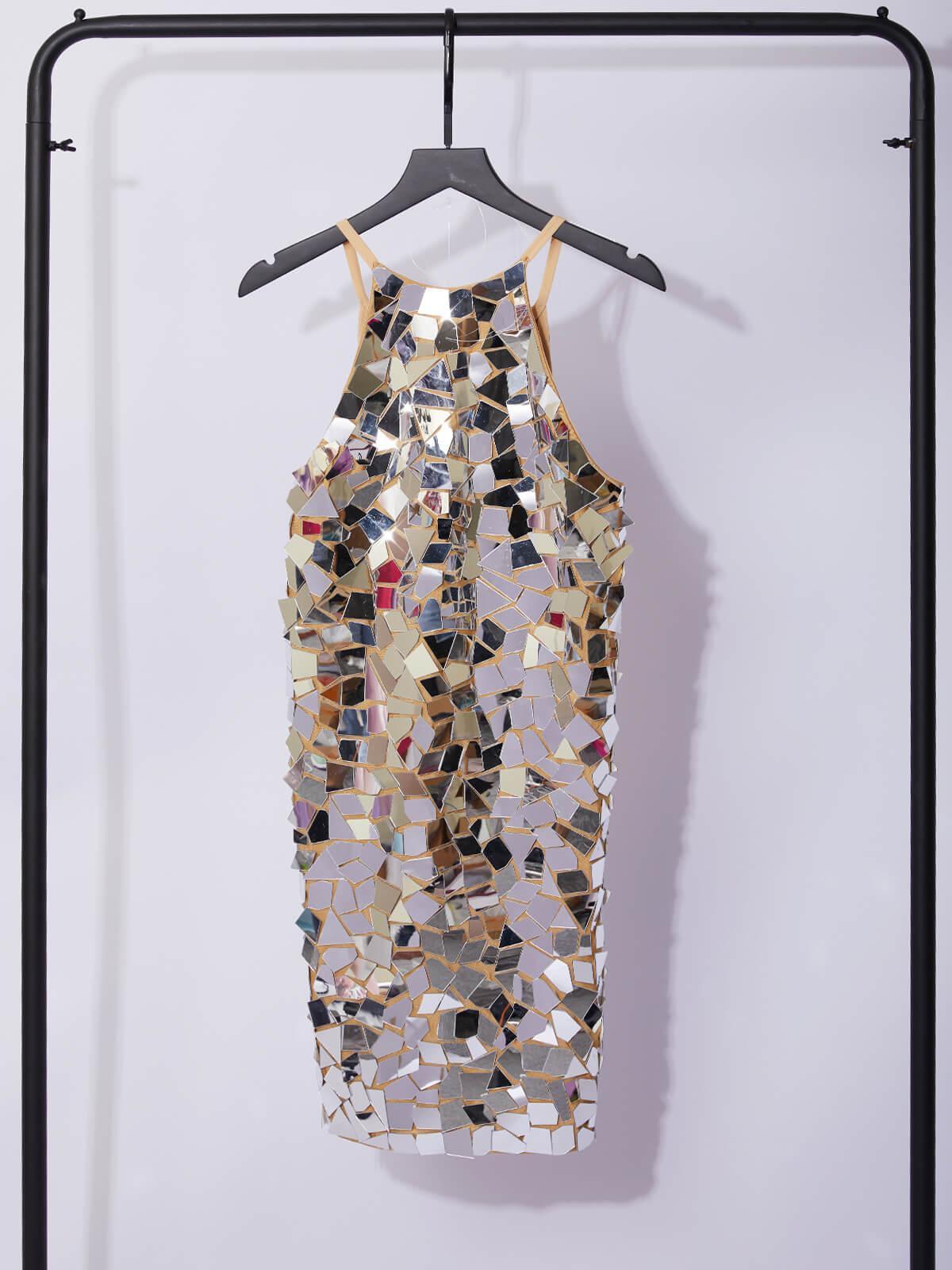 Silver mirror sequin halter mini dress on a hanger, sleeveless reflective mosaic fabric