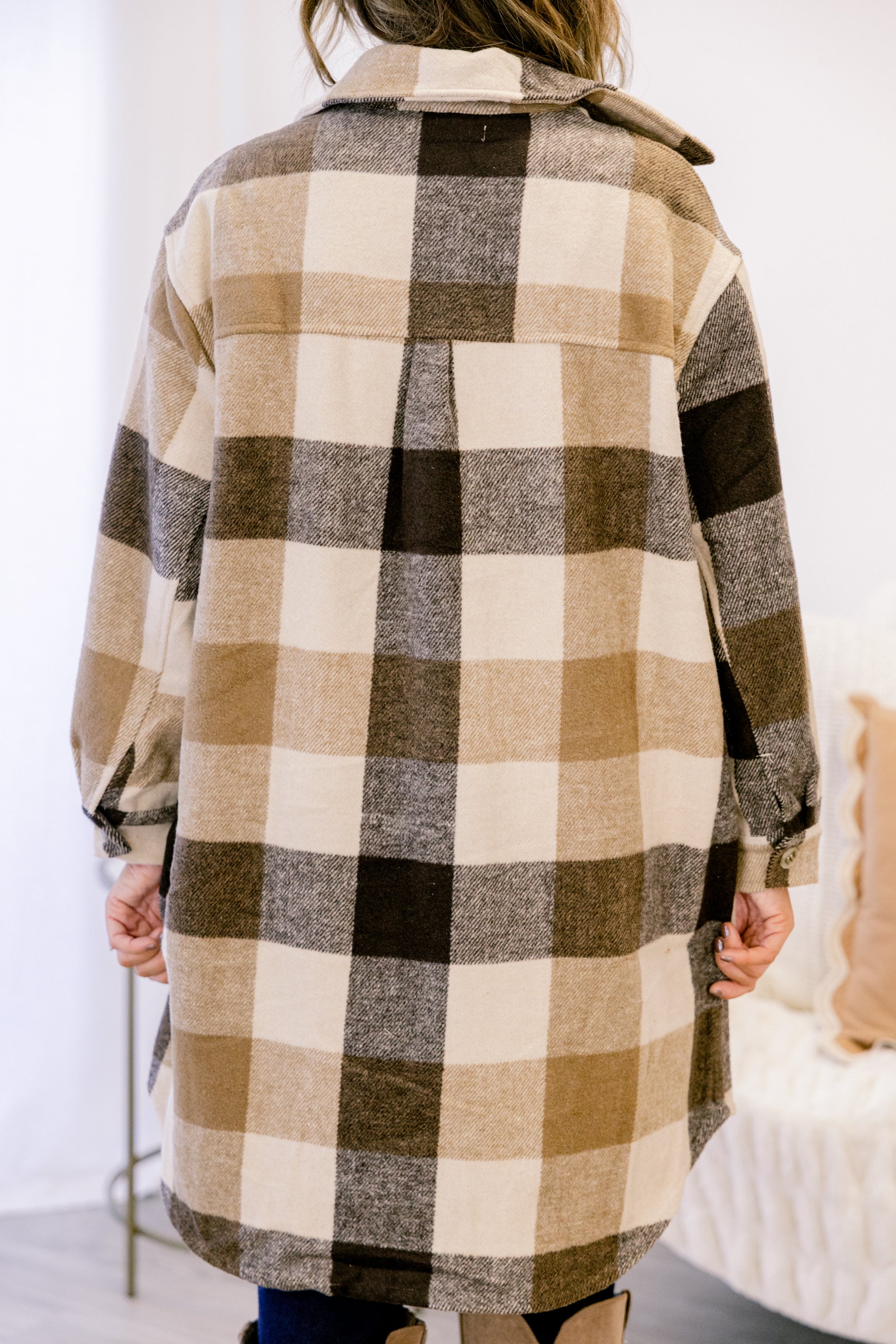 Camel buffalo plaid coat back with yoke seam, long sleeves, and button cuffs
