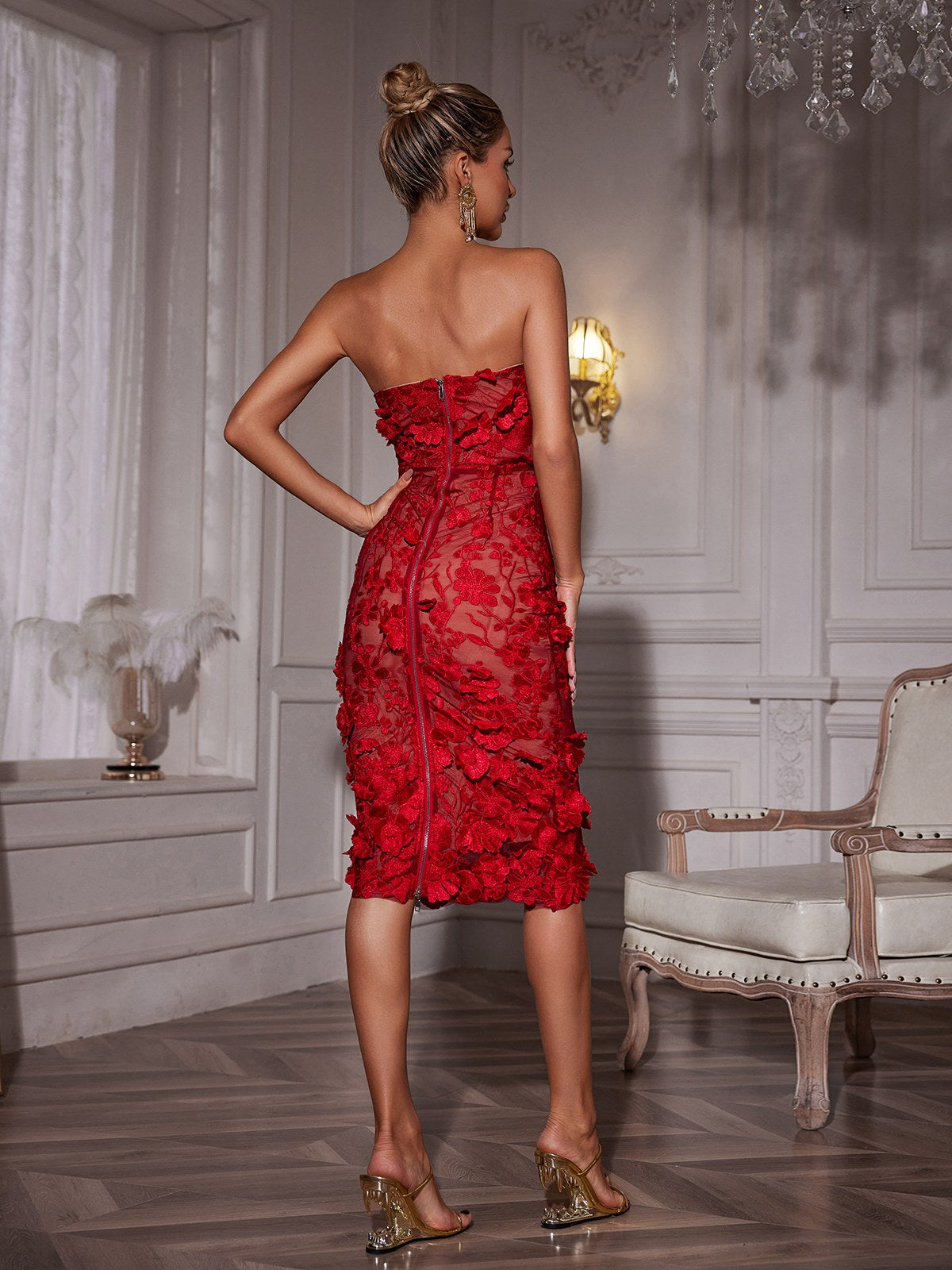 Red strapless floral midi dress from back view with fitted waist and layered ruffles