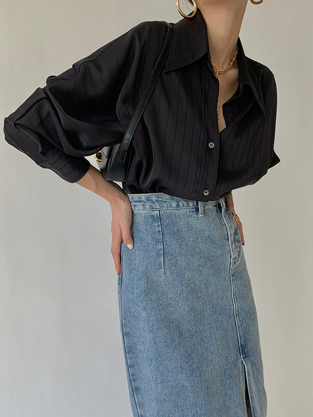 Black satin blouse with open collar, button-front, long sleeves, tonal stripe
