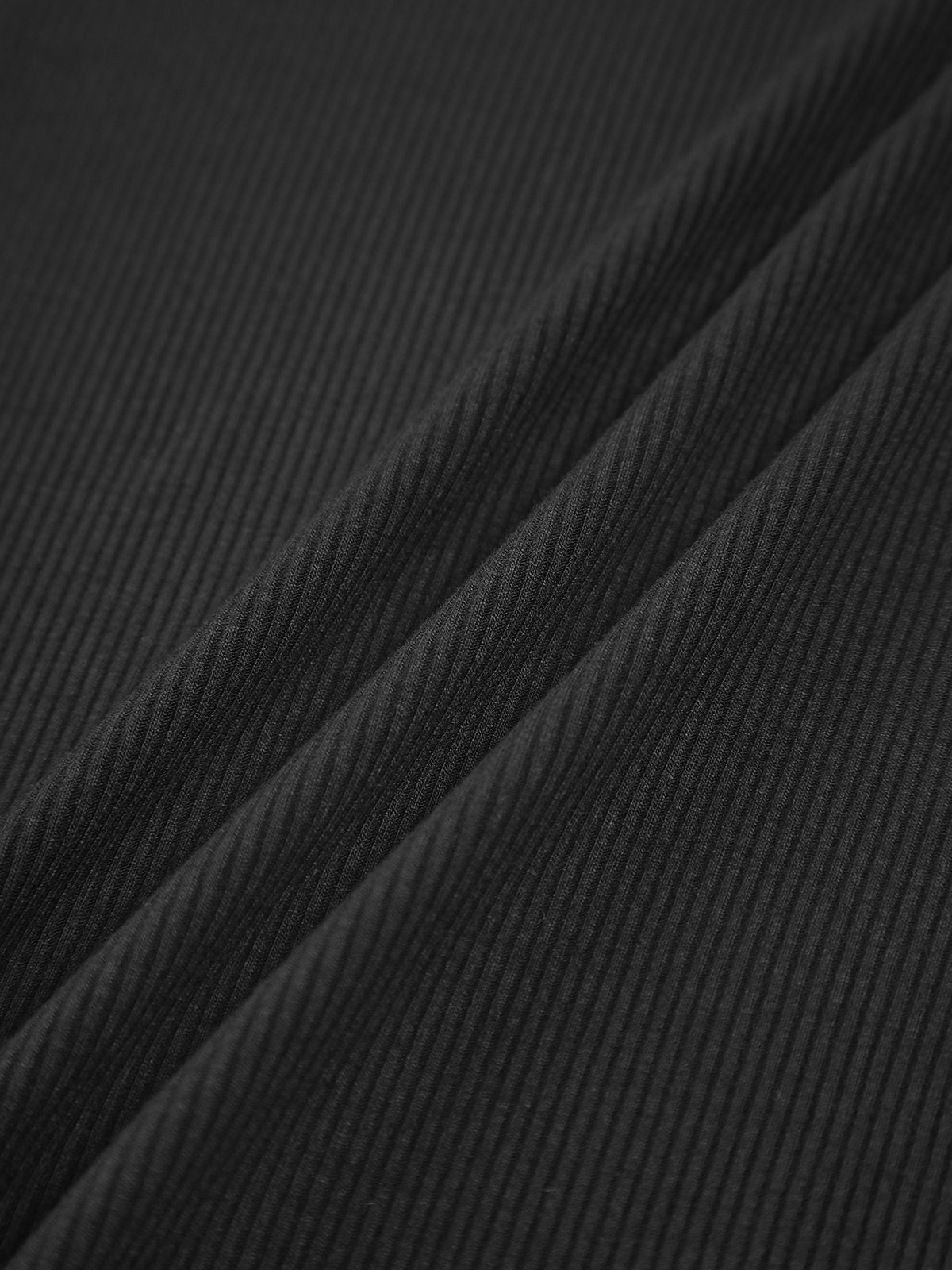 Black ribbed knit fabric texture with fine vertical ribbing
