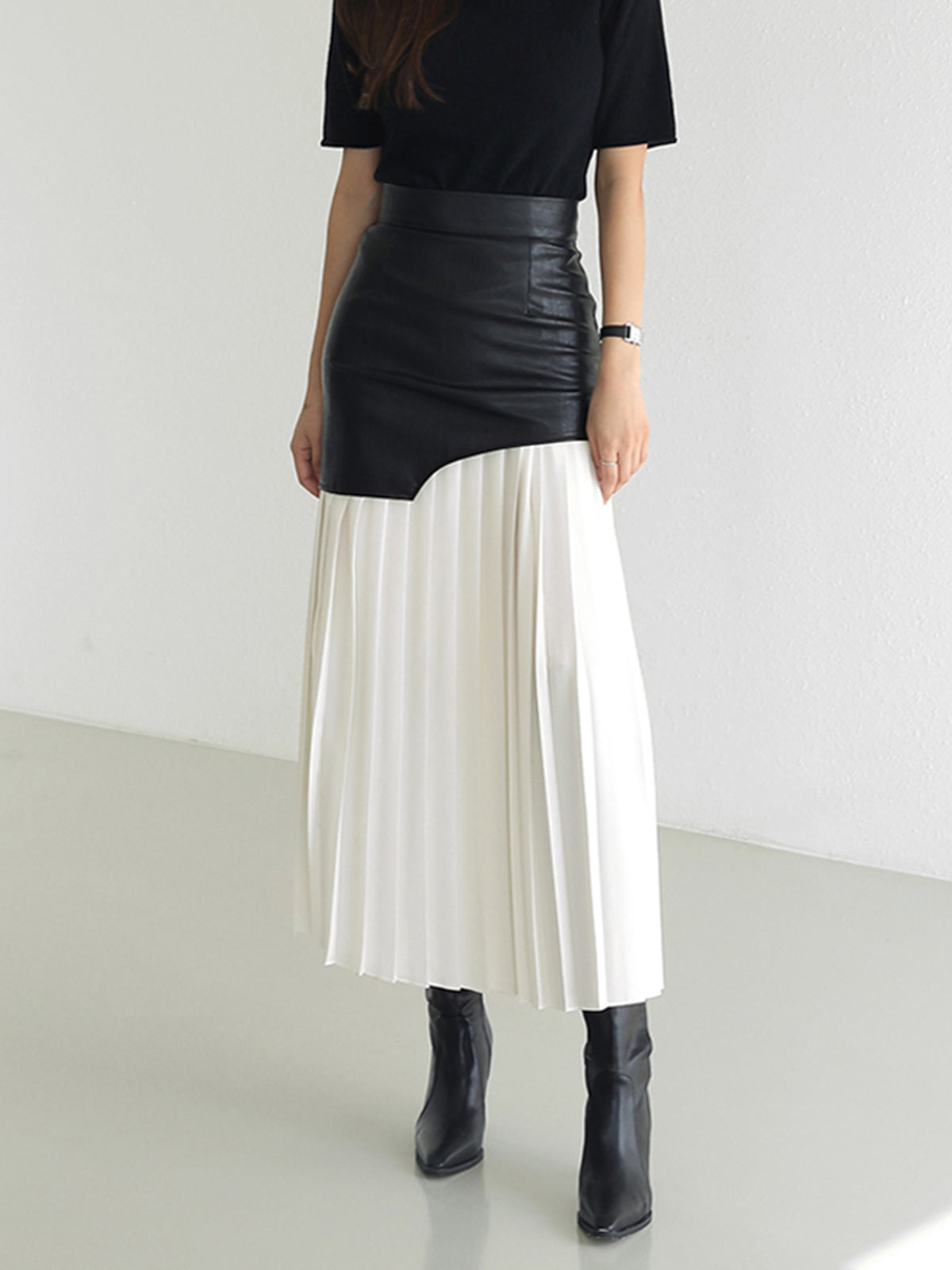Black-and-white two-tone leather maxi skirt with pleated contrast panel, high waist