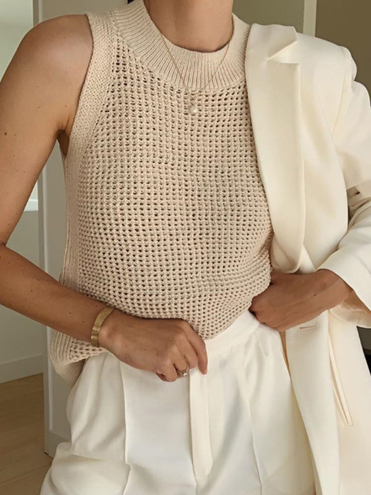 Cream open-knit cotton tank top, sleeveless with ribbed crew neckline and curved hem
