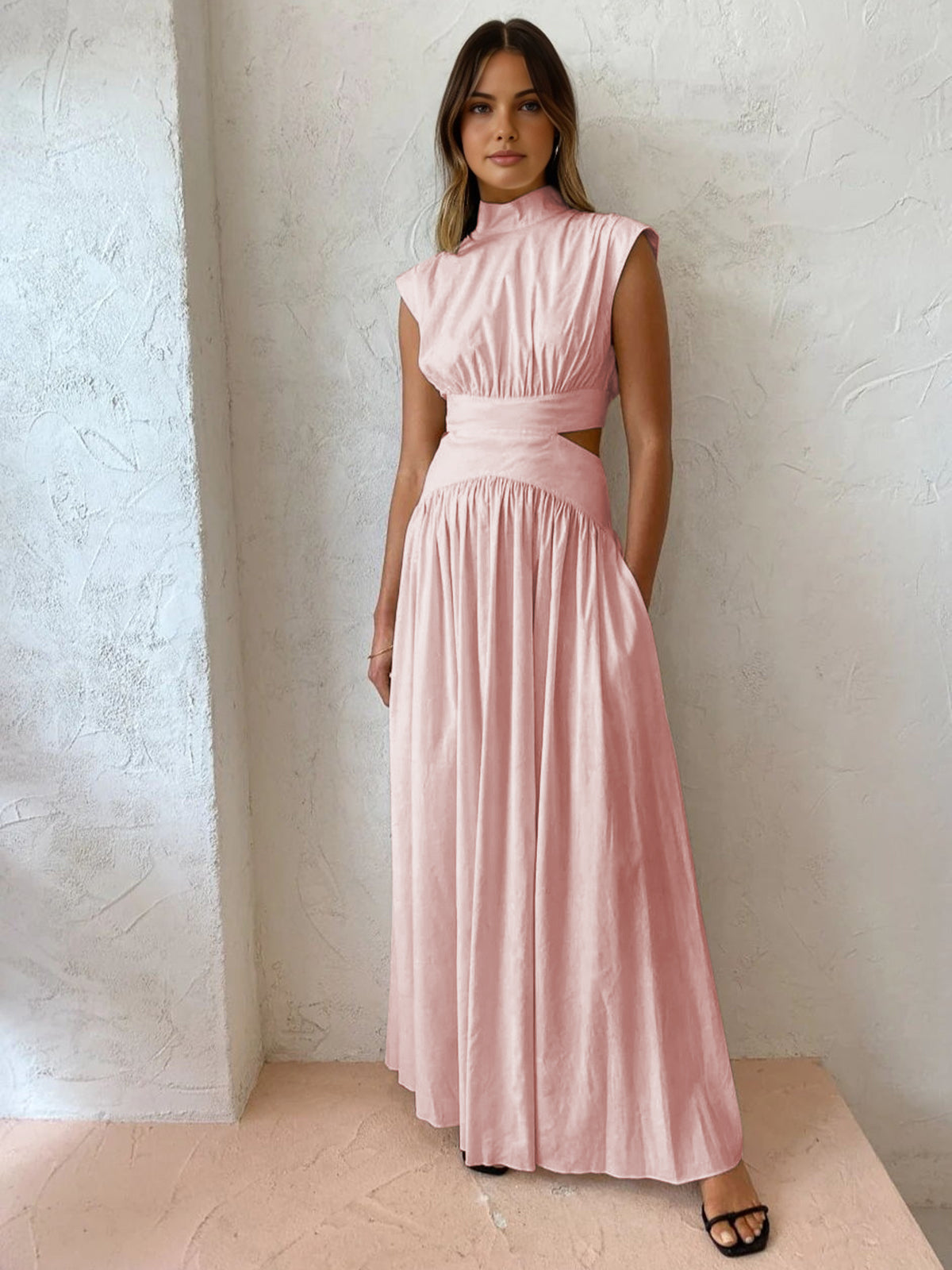 Pink sleeveless mock-neck maxi dress with ruched bodice and full gathered skirt