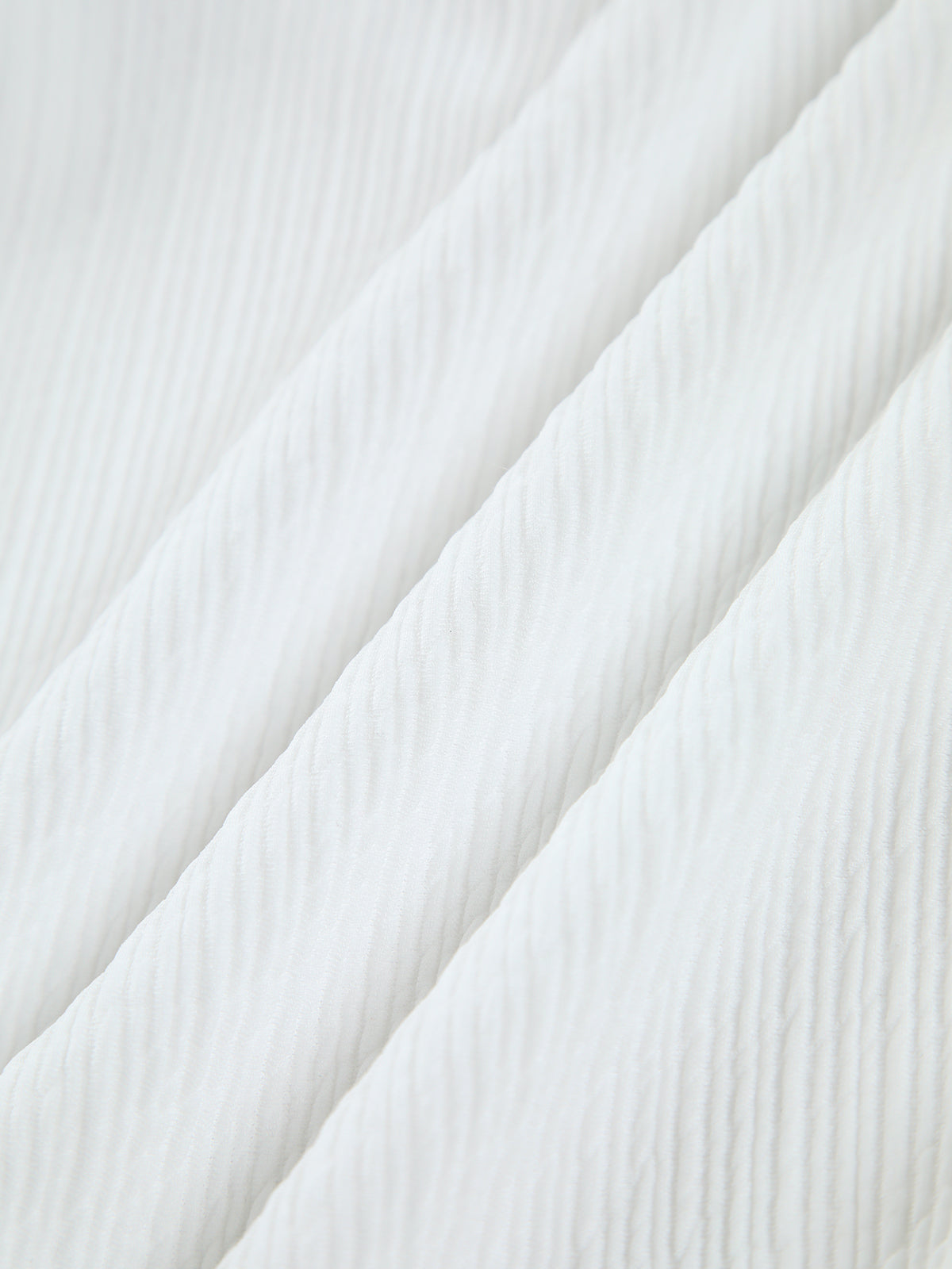 White ribbed stretch nylon fabric texture, shown in close drape