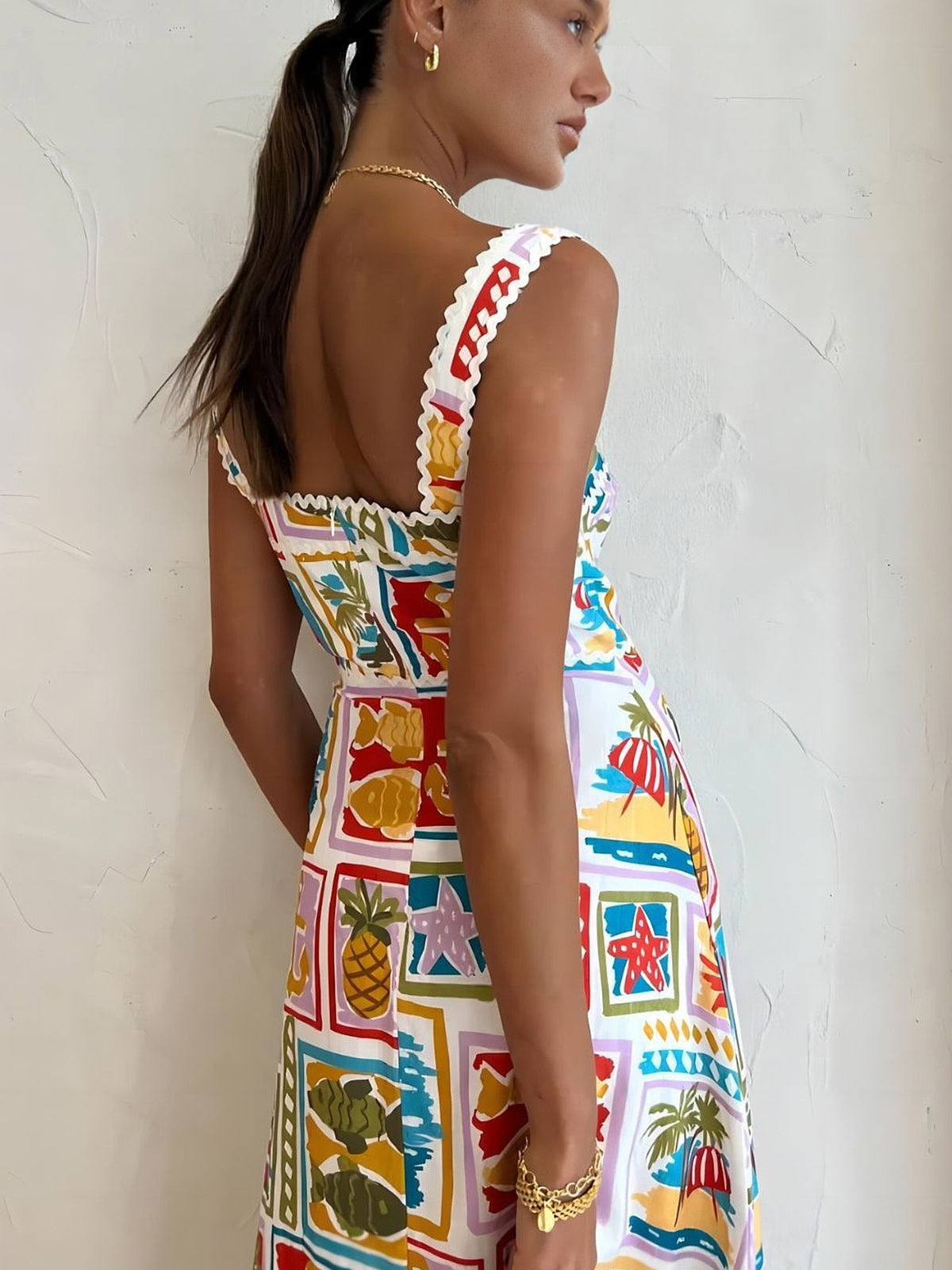 Multicolor sleeveless long dress, side view with ruffled shoulder trim