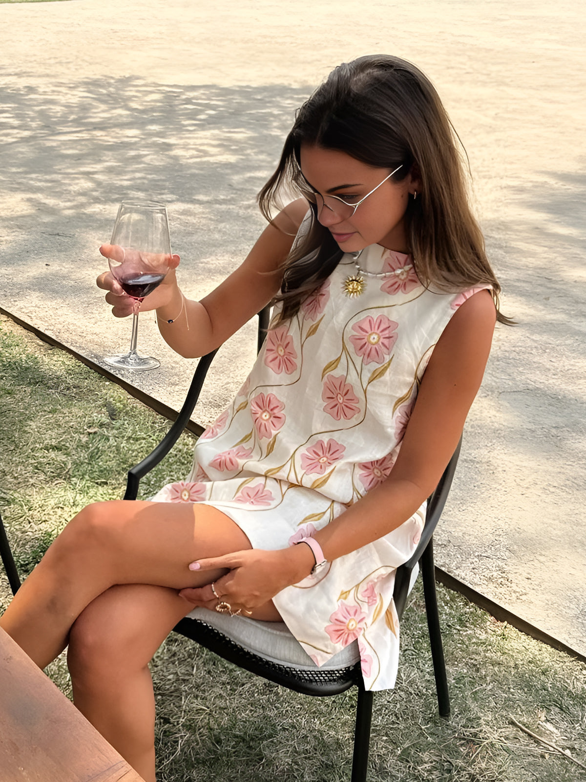 White sleeveless mini shift dress with round neck and pink floral vine print