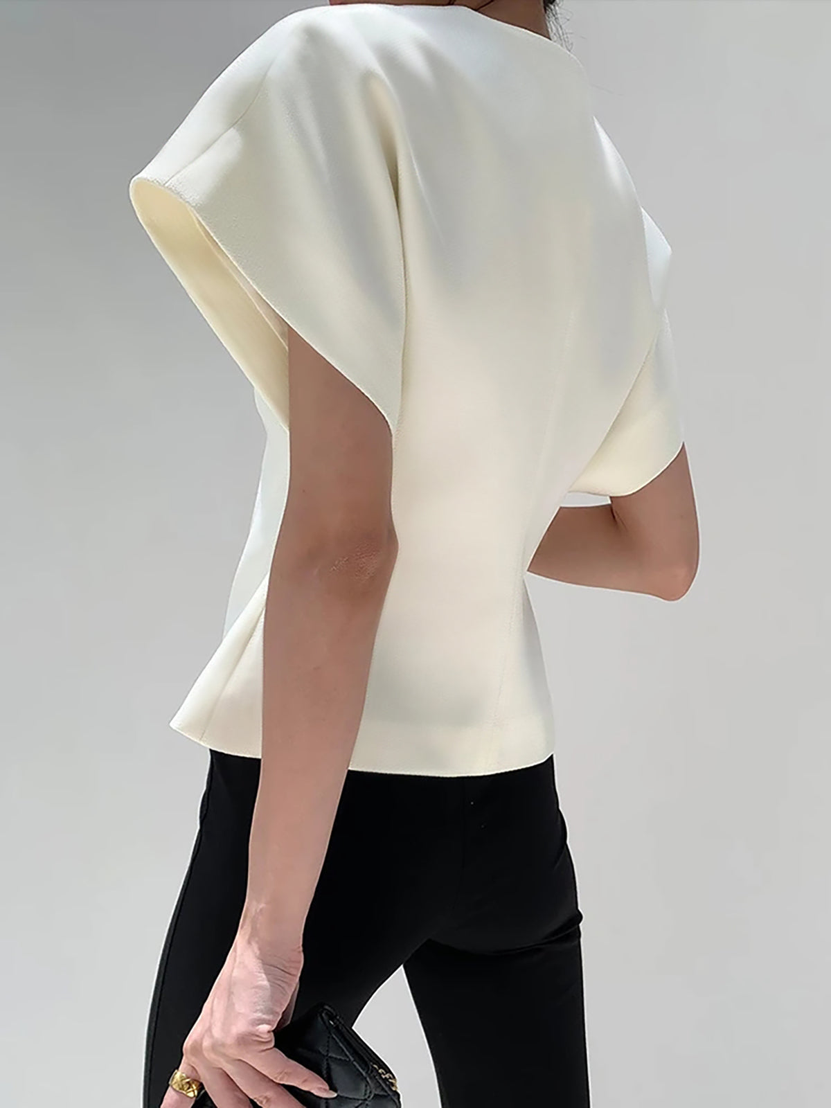White crepe blouse back view with V-neck front opening and short cap sleeves