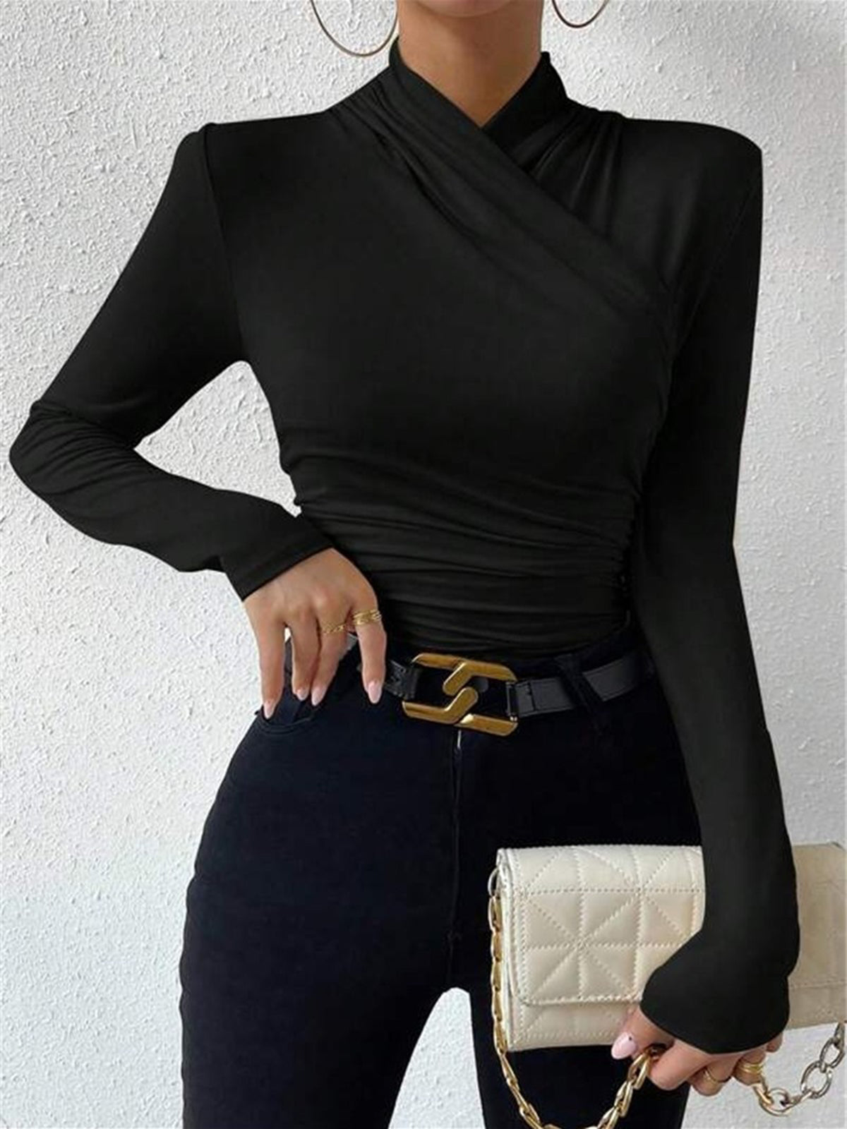 Black mock-neck long-sleeve wrap top with ruched waist and crossover front
