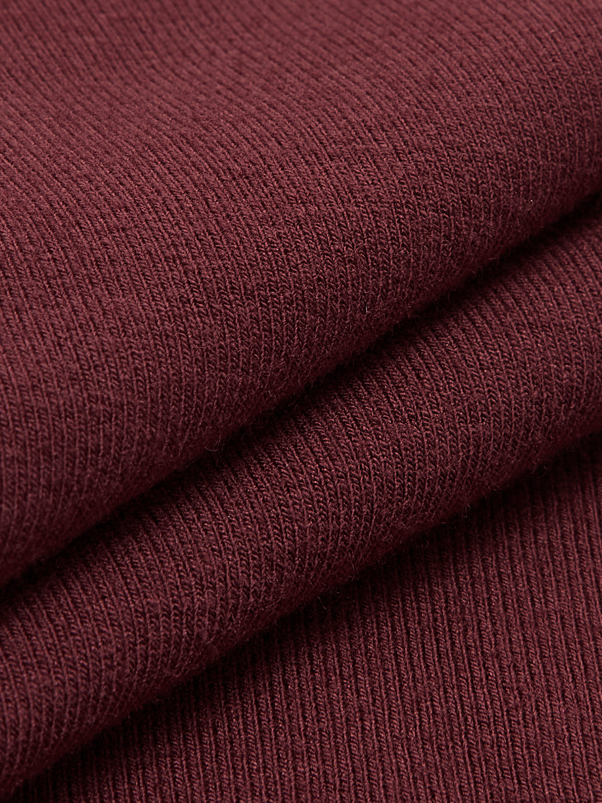 Burgundy ribbed knit fabric close-up