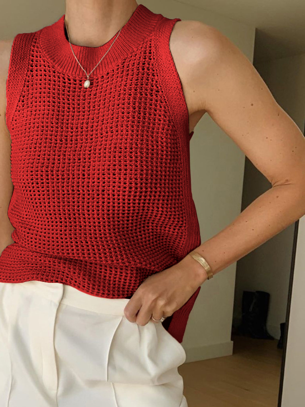 Red open-knit cotton sleeveless tank with ribbed crew neckline and fine crochet texture