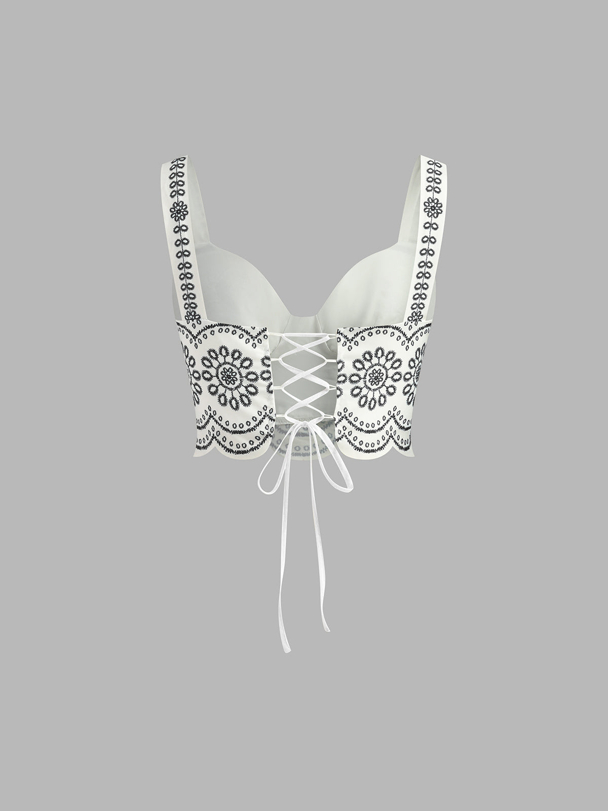 Black-and-white embroidered linen bustier crop top with center lace-up ribbon ties