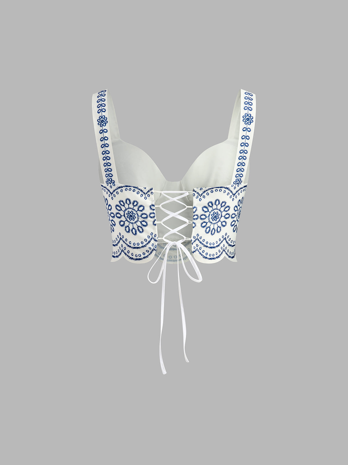 Blue-and-white embroidered linen bustier crop top with lace-up bow center detail
