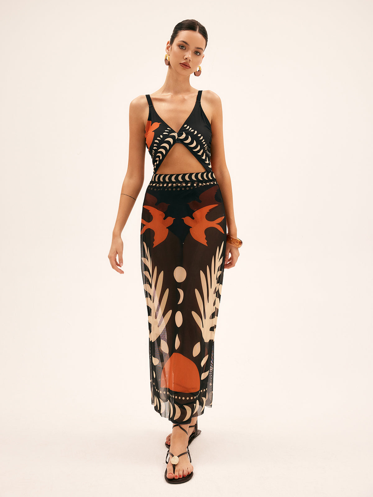 Sheer chiffon maxi skirt in black with orange and beige abstract tropical print