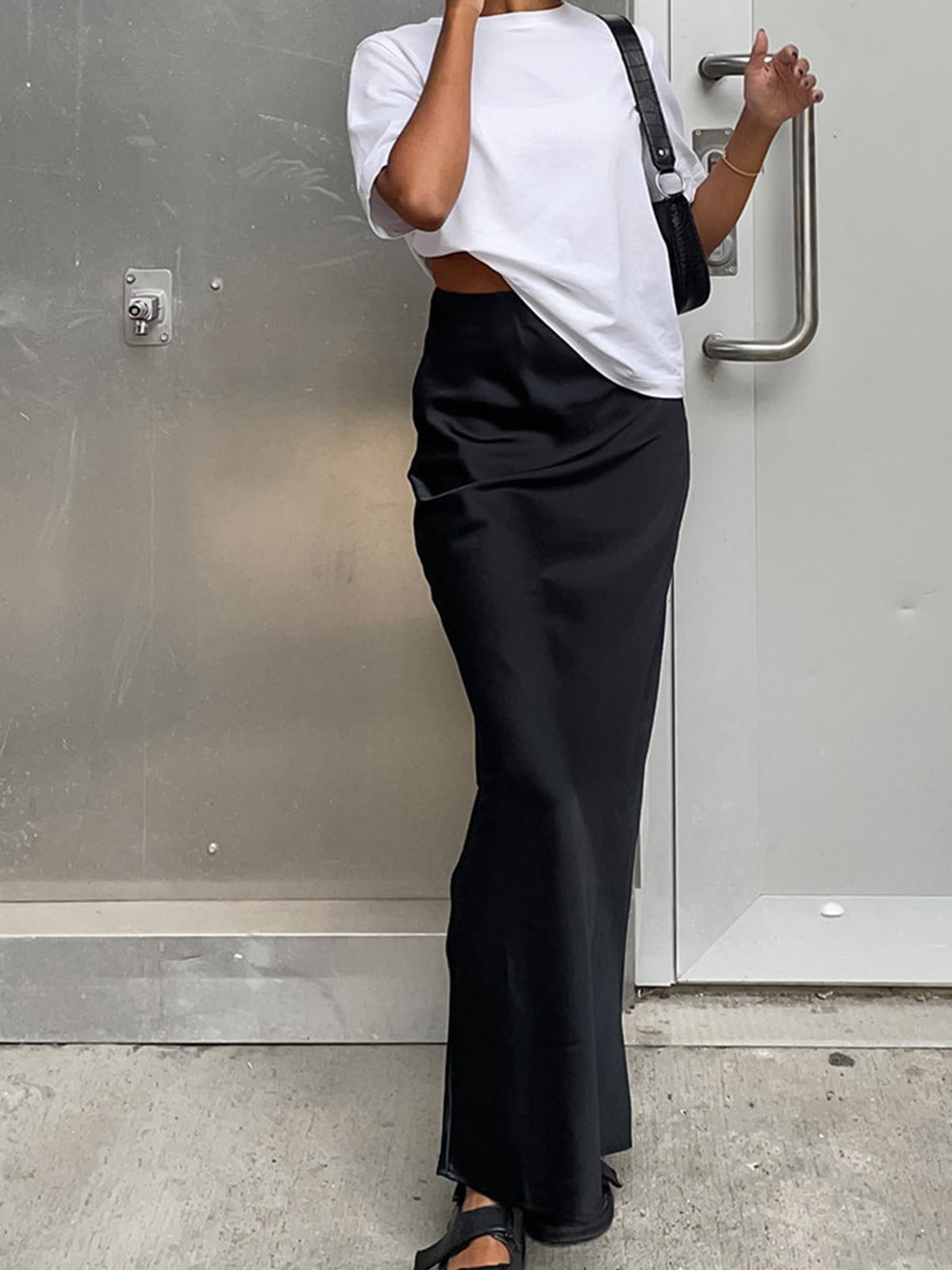 Black satin straight maxi skirt with high waist and side slit