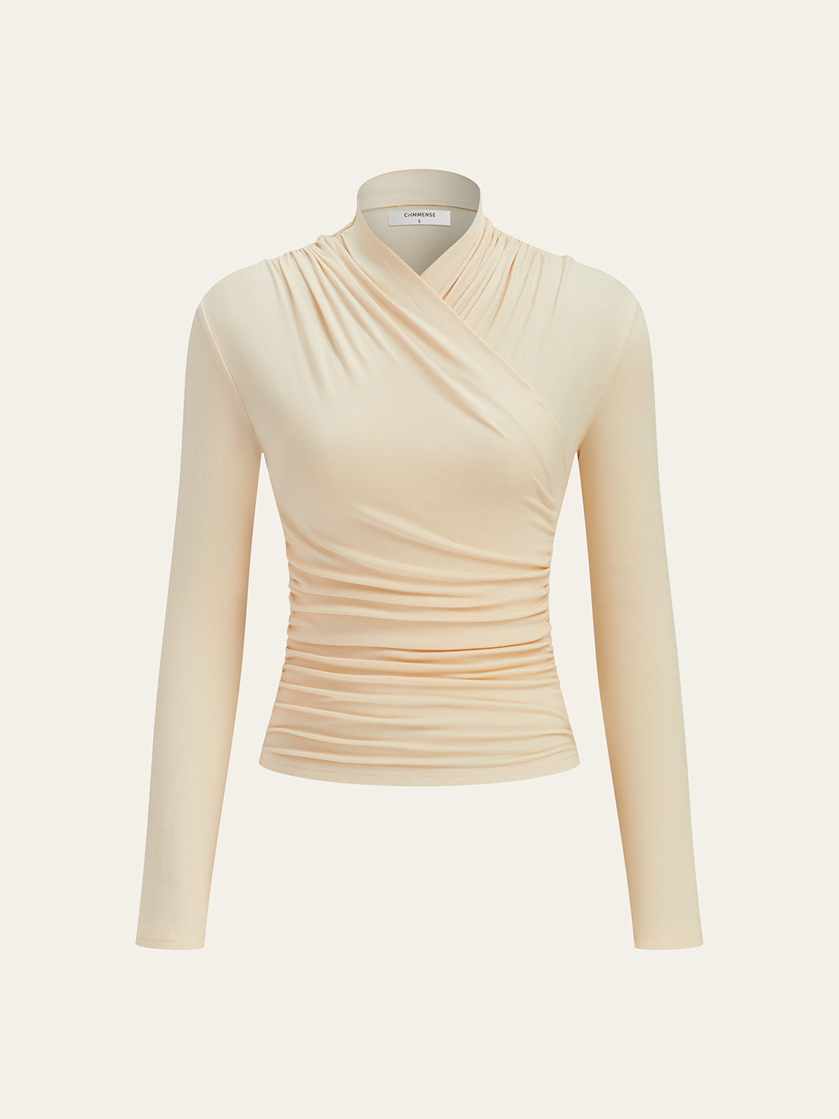 Apricot mock-neck long-sleeve wrap top with ruched waist, shown on a mannequin