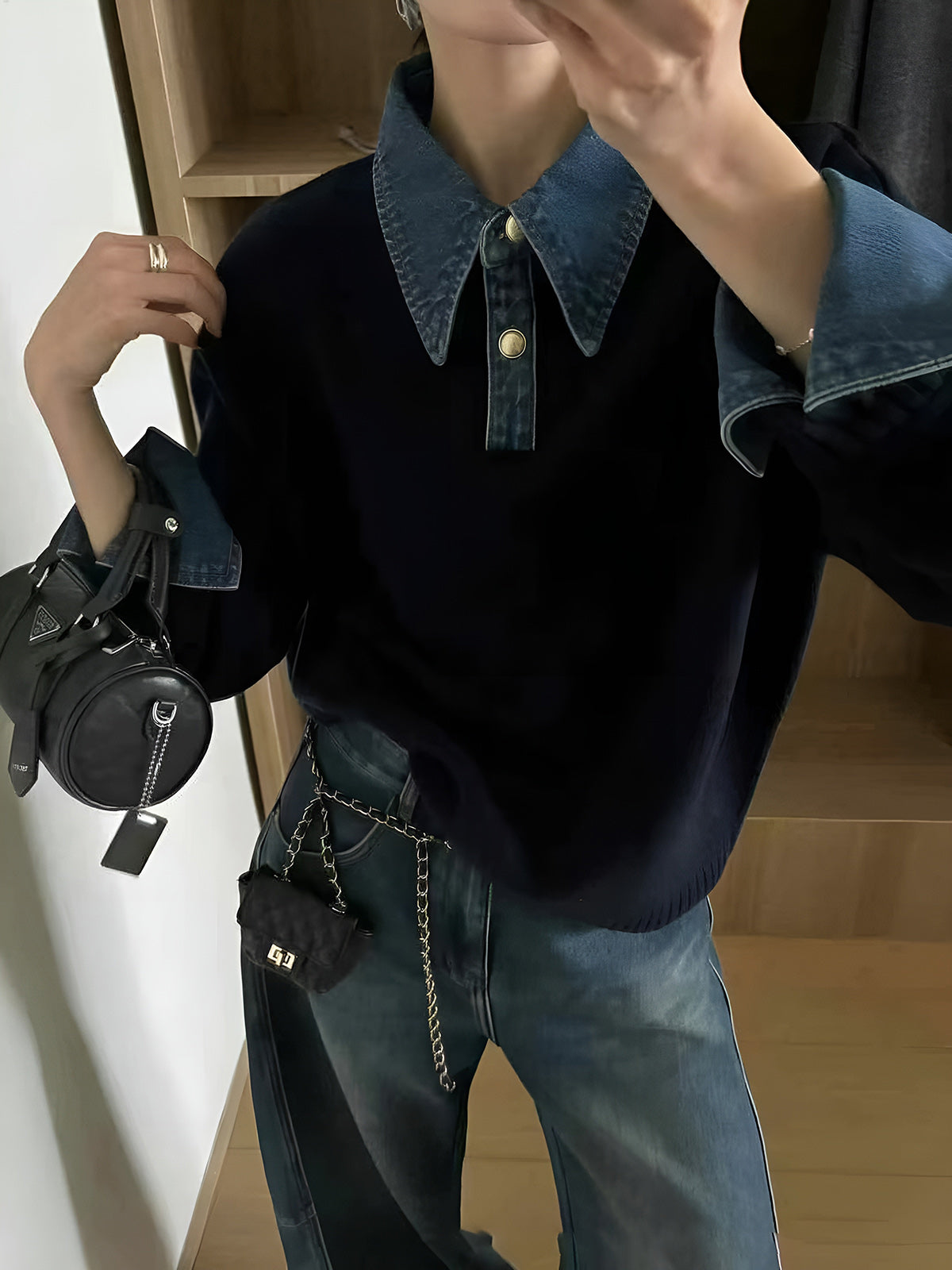 Women’s navy knit jumper with denim collar and cuff trim, worn with jeans