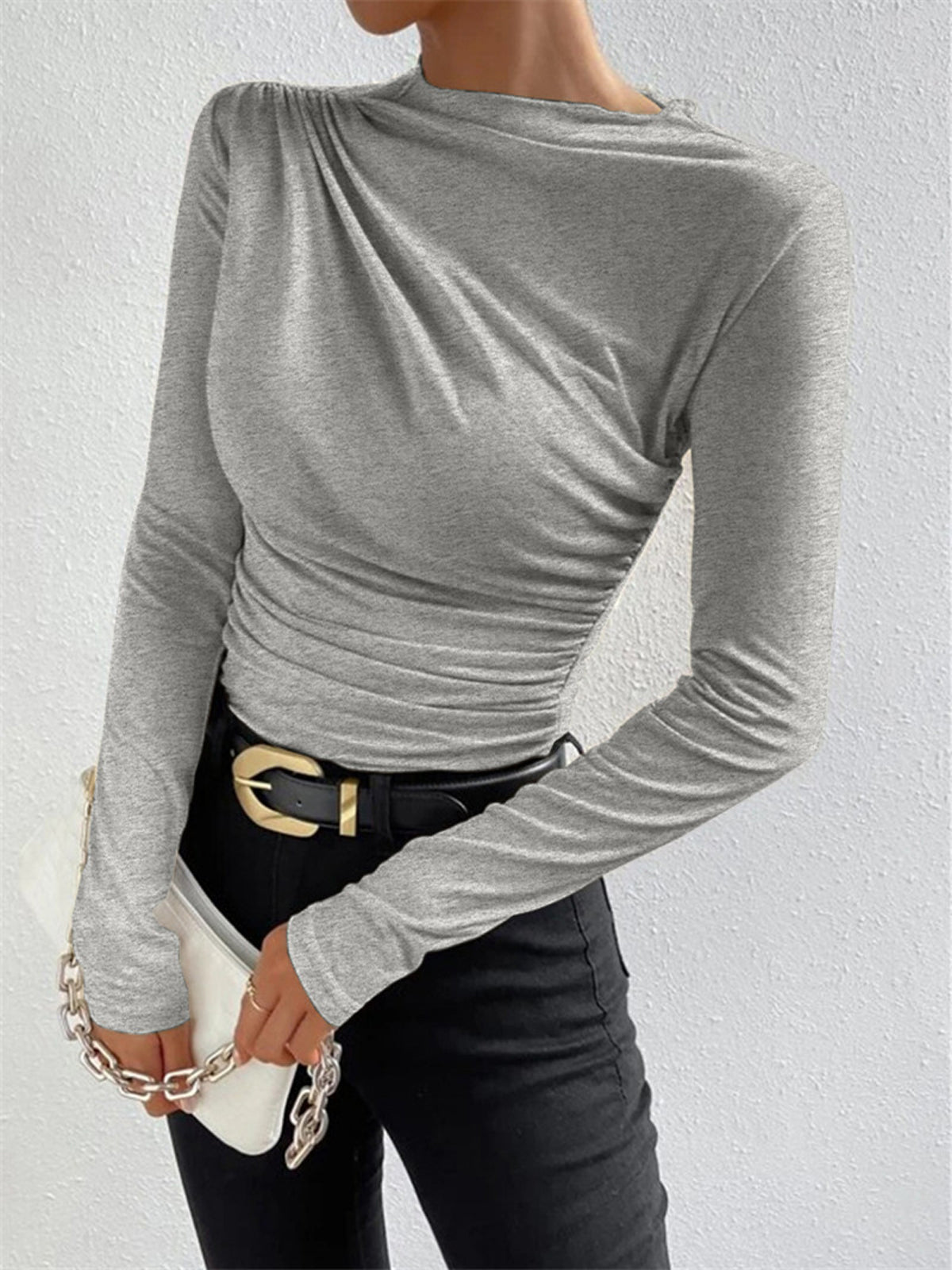 Light grey fitted long-sleeve top with draped neckline and ruched side panel