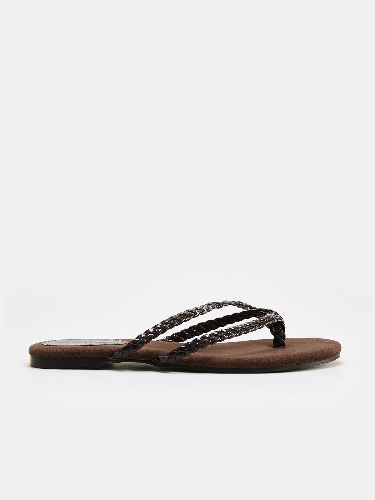 Women's brown flat flip flops with braided leather straps and flat suede footbed