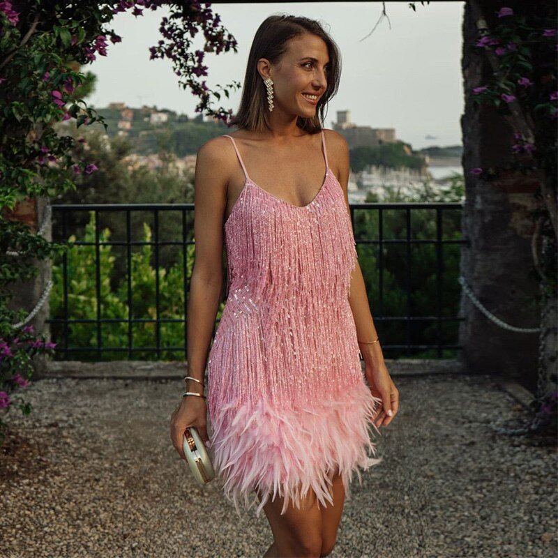 Pink crystal fringe mini dress with thin straps and layered feather hem