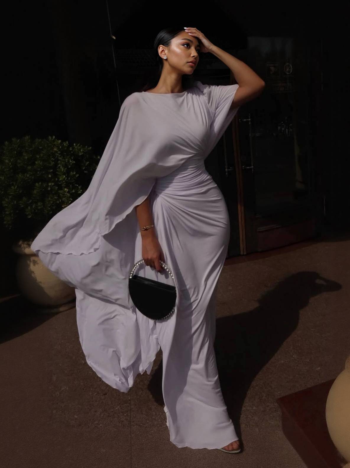 Light purple chiffon maxi dress with boat neck, ruched waist, and draped cape sleeves