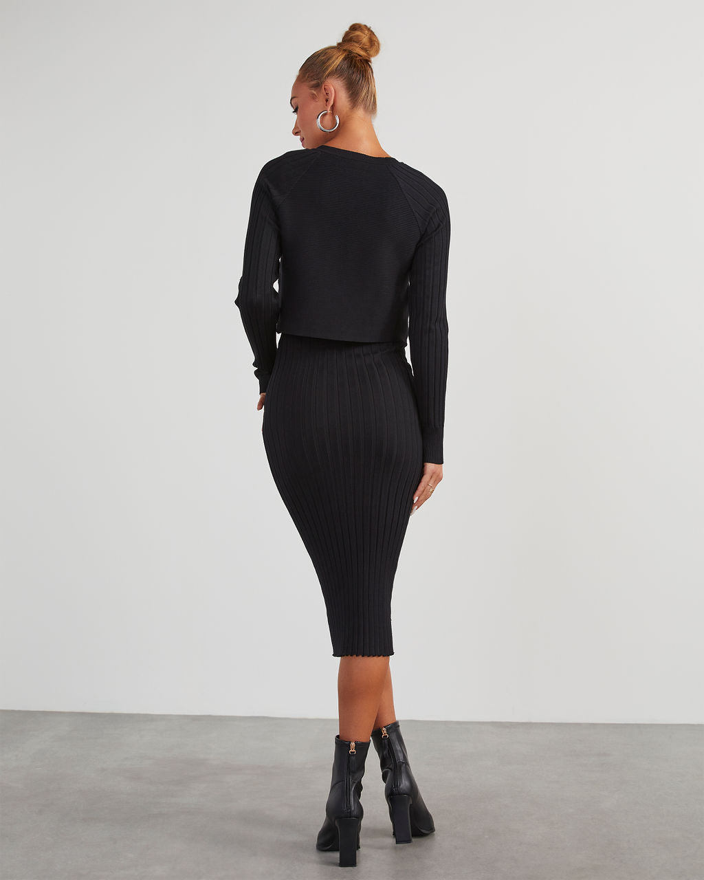 Black ribbed knit midi dress with long sleeves and fitted back view