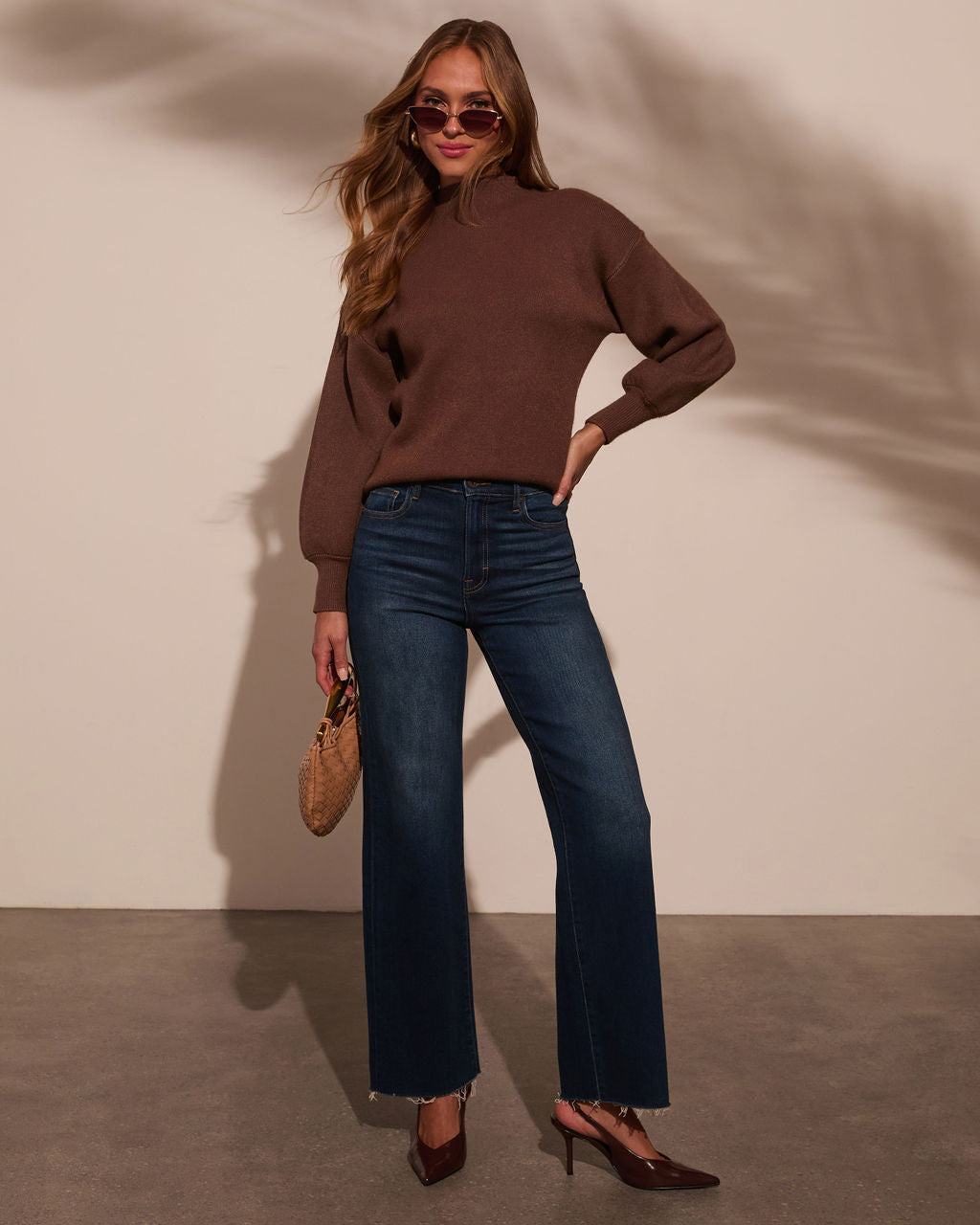 Mocha/brown mock neck sweater with long sleeves and ribbed cuffs and hem.