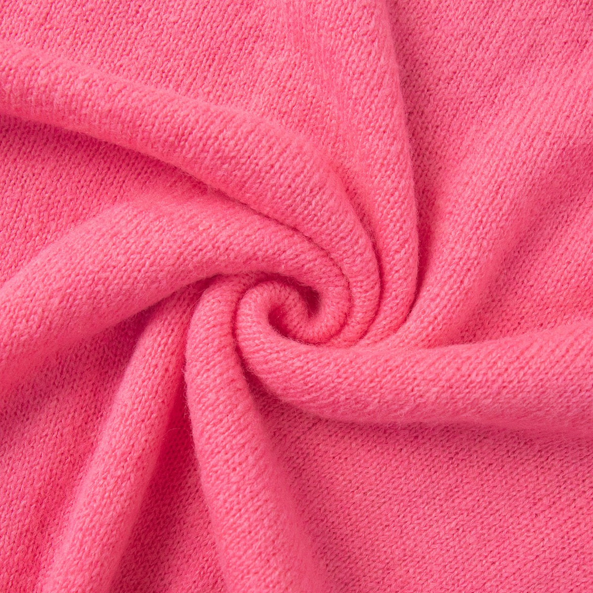 Bright pink knitted fabric detail with soft texture