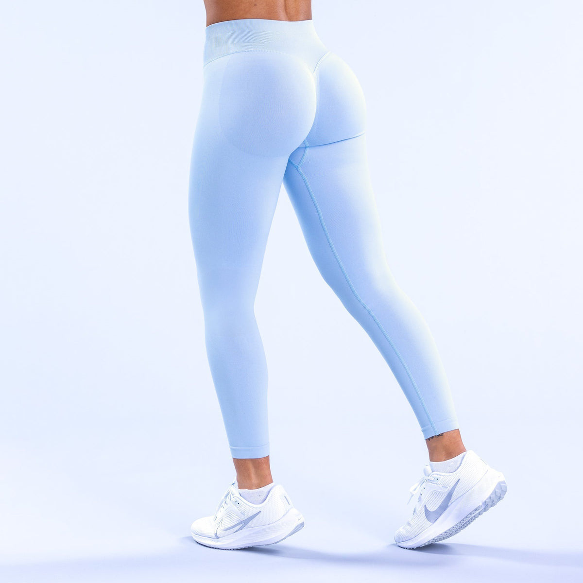 High-waisted light blue leggings, full-length with smooth butt-lifting contour.