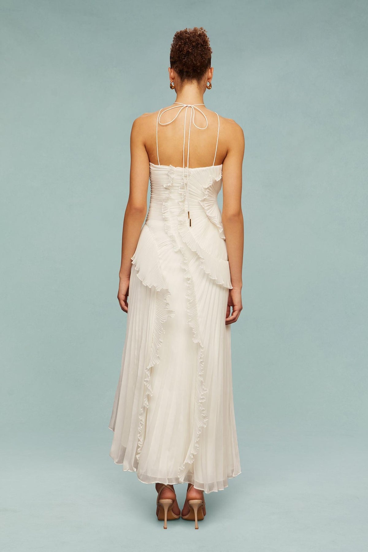 White chiffon maxi dress with lace-up cross-back straps and layered ruffle skirt