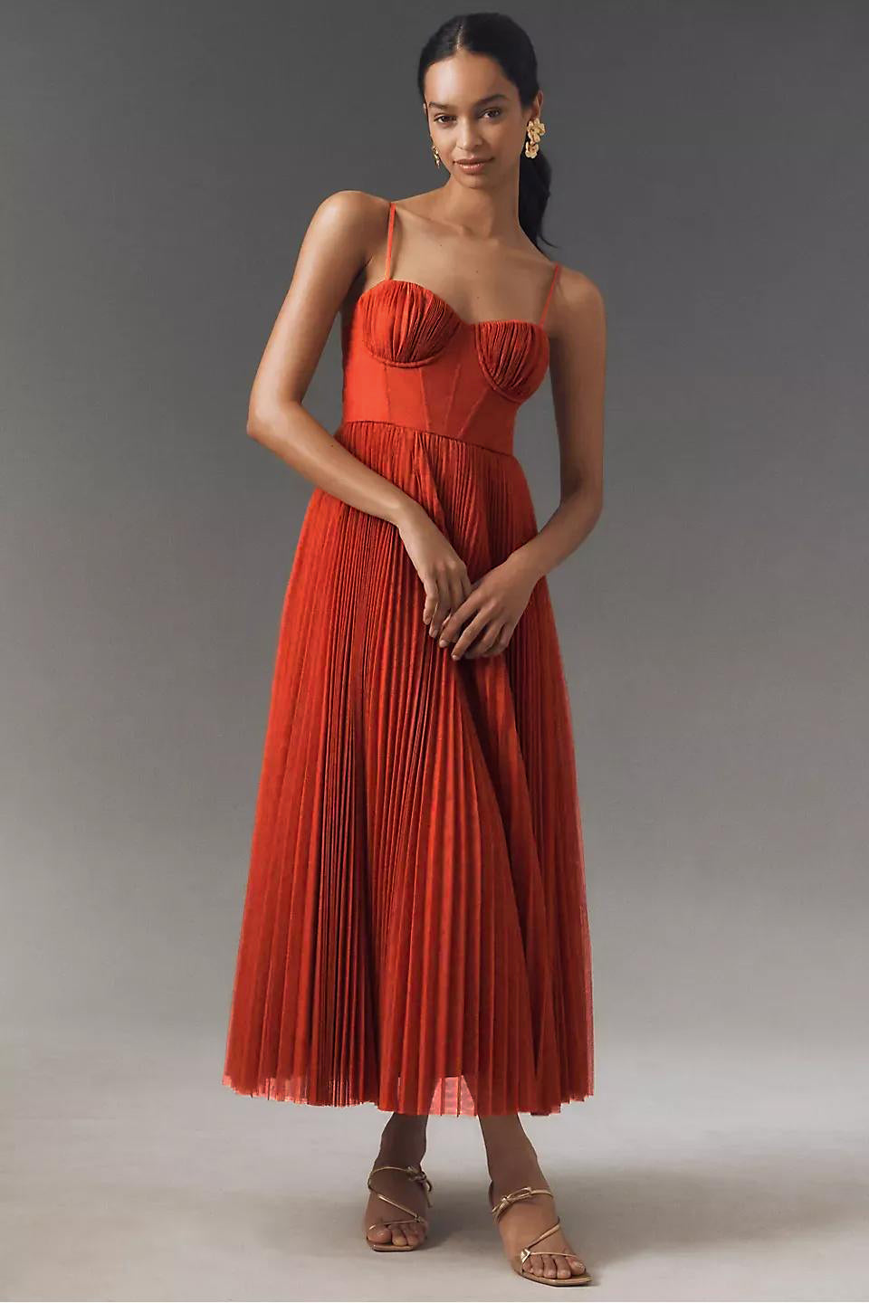 Red midi corset-bodice chiffon dress with pleated skirt and spaghetti straps