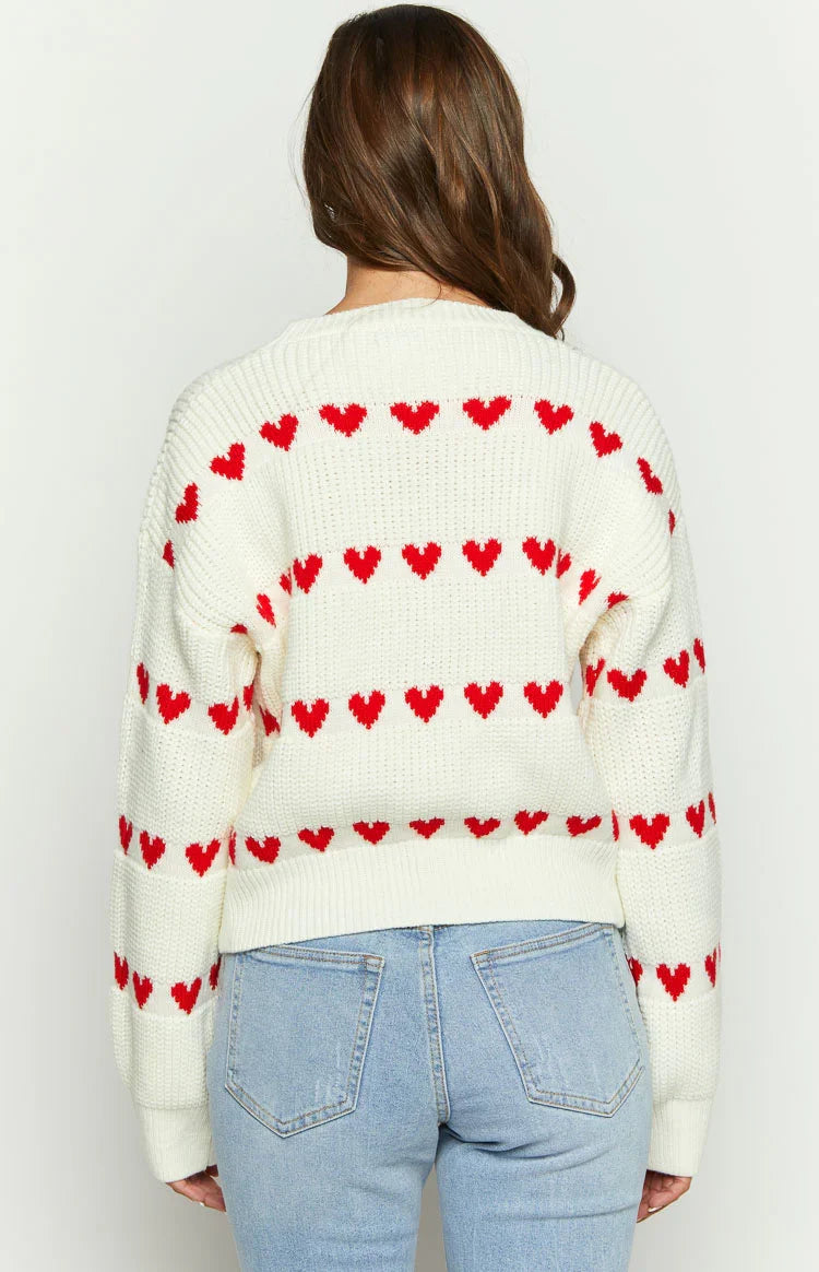 Back view white knit jumper with red heart stripe pattern and ribbed waistband