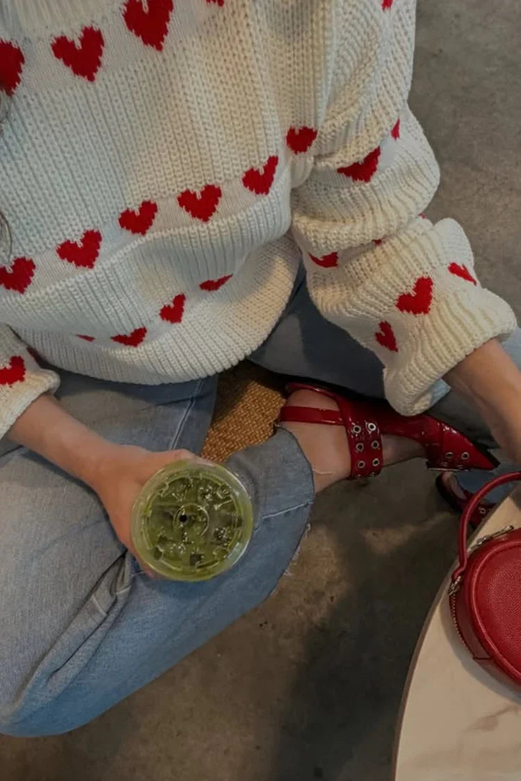 White knit jumper hem and sleeve cuffs with red heart stripe pattern