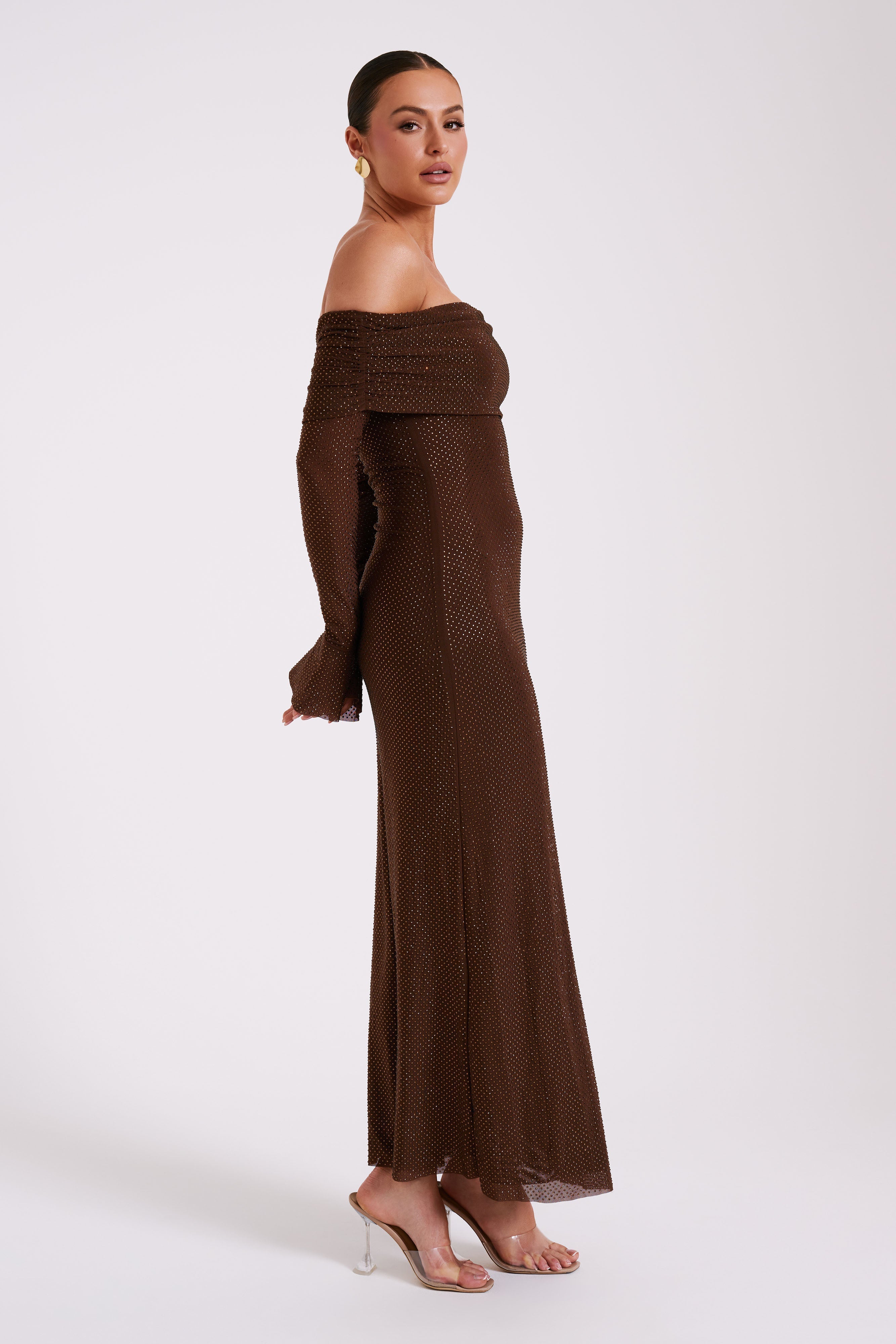 Brown sequin off-shoulder maxi dress shown from side, long sleeves with bell cuffs