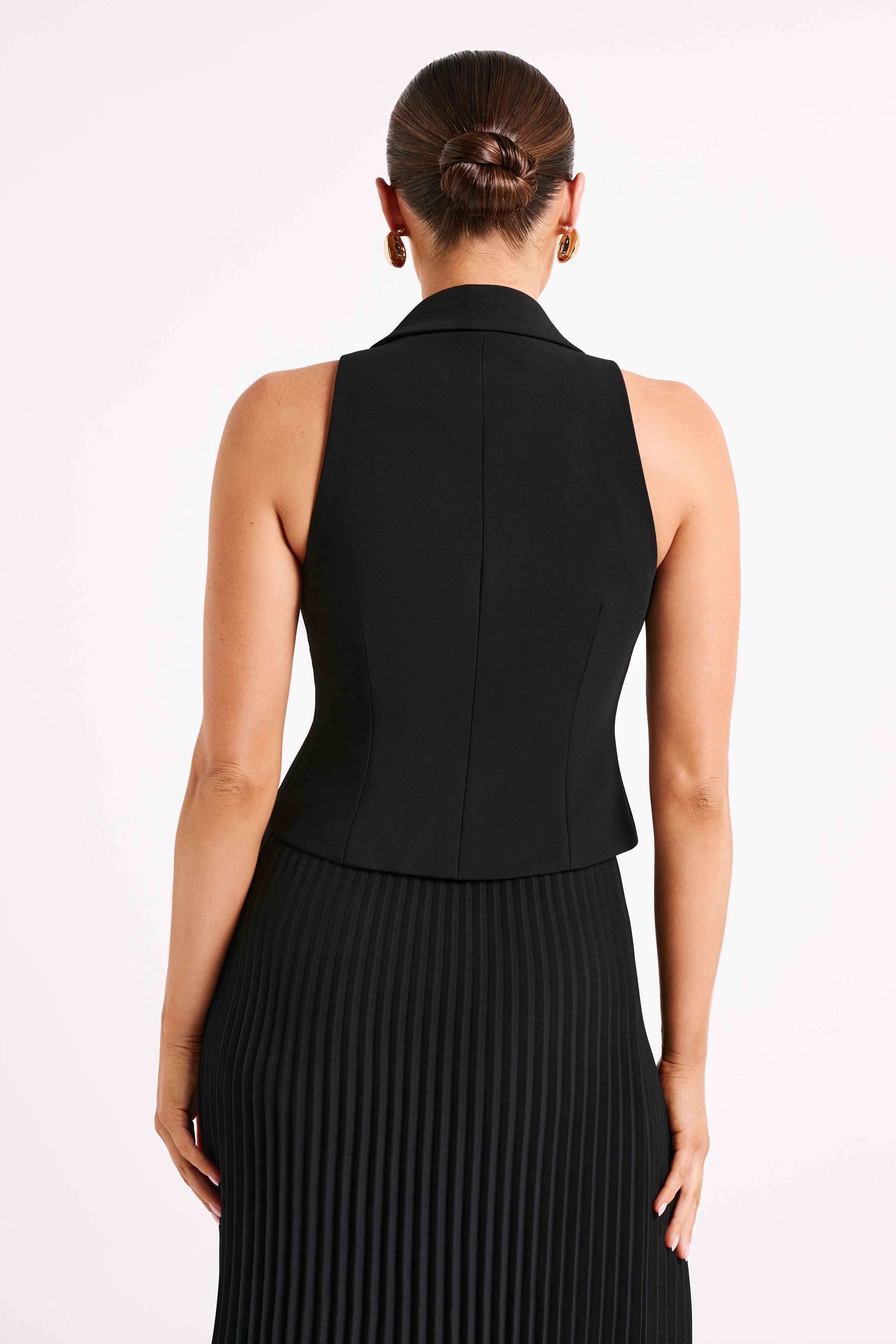 Black halter sleeveless blazer vest, back view with tailored seam detailing