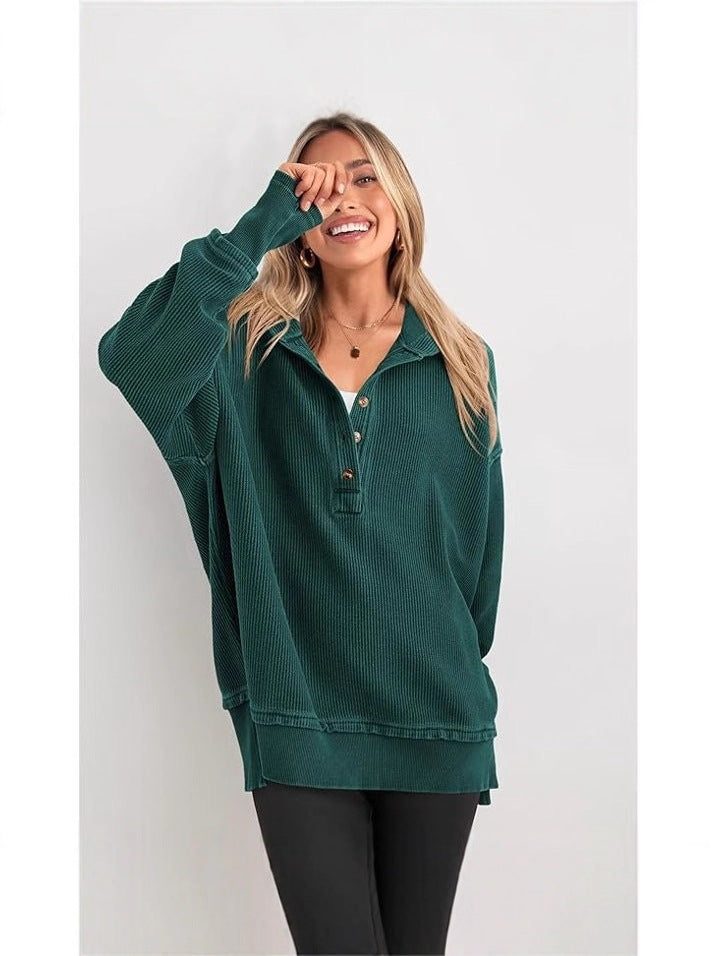 Dark green hooded henley sweatshirt with button placket and loose raglan sleeves