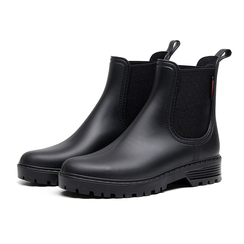 Black Chelsea rain boots, side-gusset elastic panels, chunky sole and pull tab