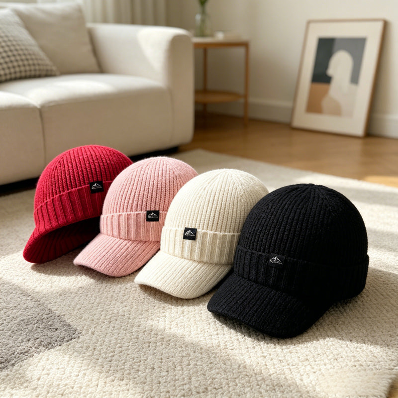 Knitted beanie hats in four colors: deep red, pink, off-white, black