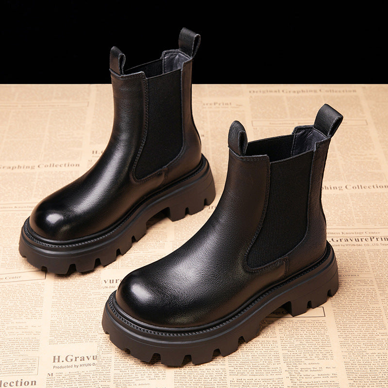Black chunky Chelsea boots with elastic side panels and rugged platform sole