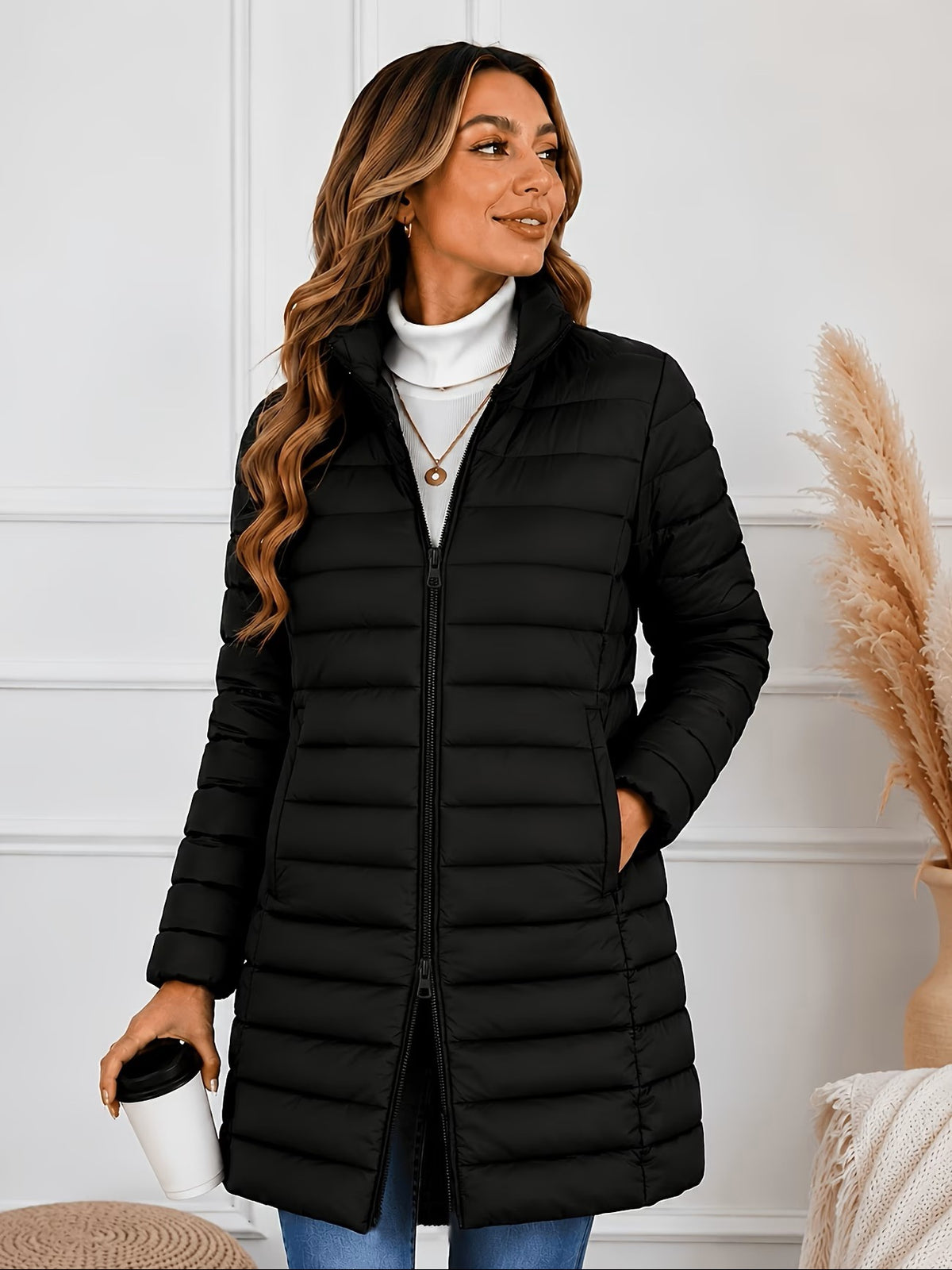 Women\u2019s quilted puffer jacket in black with stand collar and full-length zip