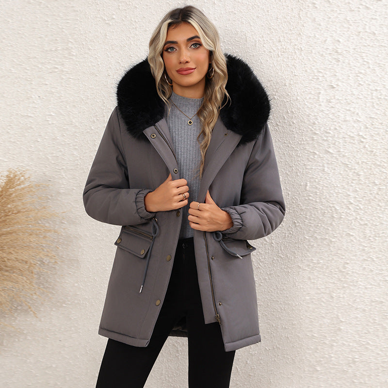 Women's gray mid-length hooded parka with faux-fur trimmed hood, button front, drawstring waist pockets