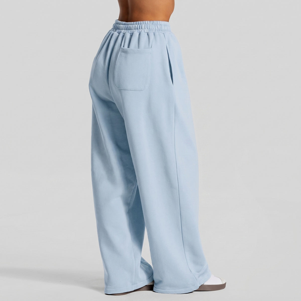 Light blue wide-leg yoga pants with elastic waistband and vertical white contrast stripe