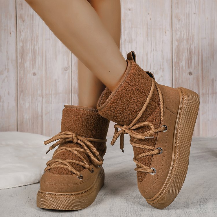 Brown fleece-lined lace-up snow boots with shearling cuff and chunky platform sole
