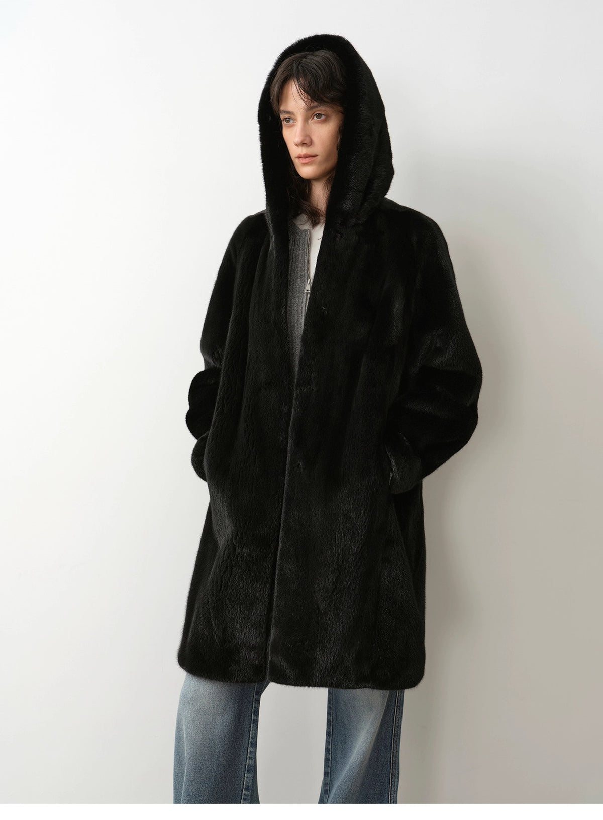 Black hooded faux fur coat with front button placket, mid-length sleeves